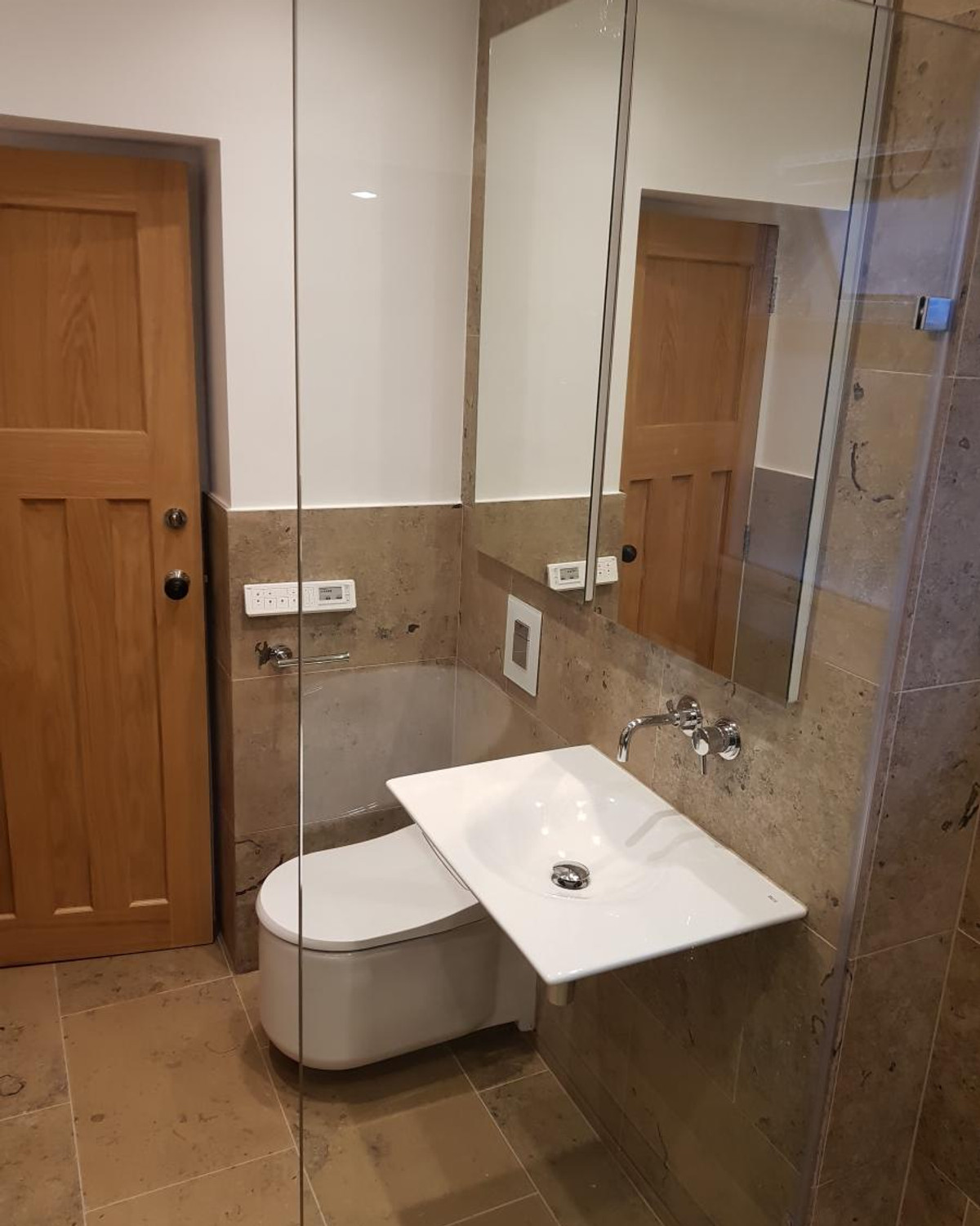 Completed Belper Designs bathroom with wall-hung basin and WC